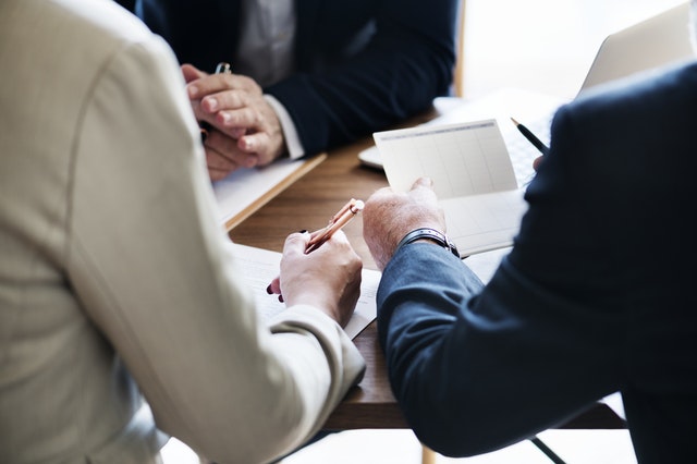 Business meeting professionals at table